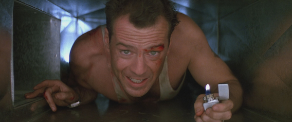 John McClane crawls through the mechanical spaces of Nakatomi Plaza in Die Hard.